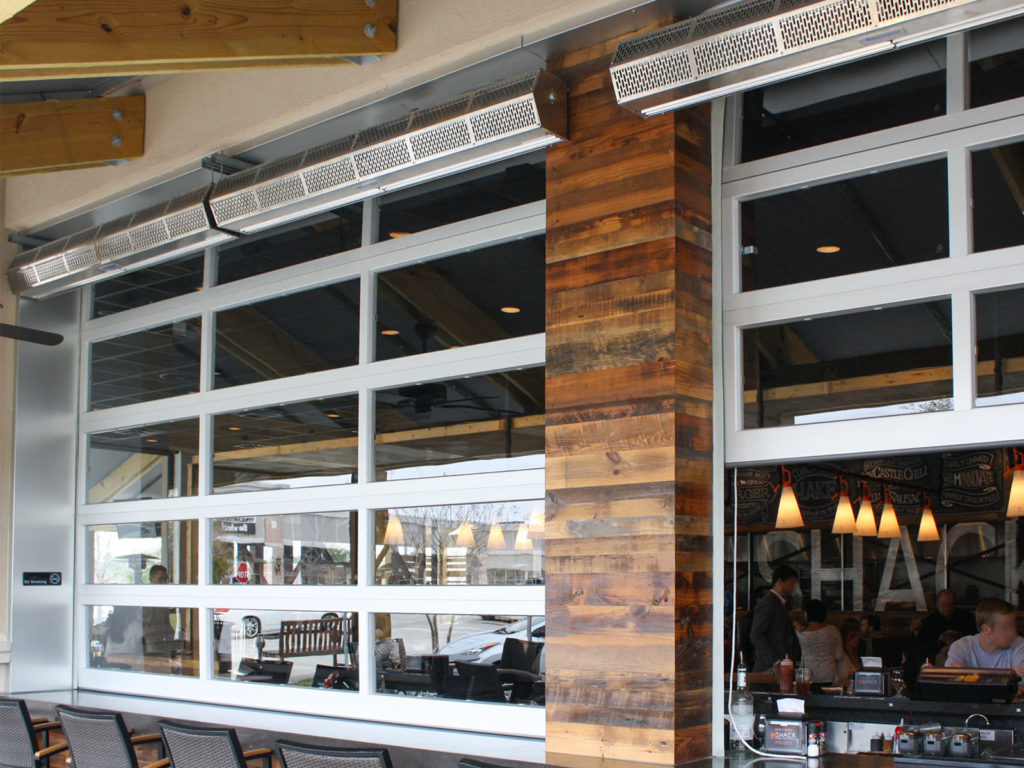 Berner air curtains installed above a restaurant's open glass entrance
