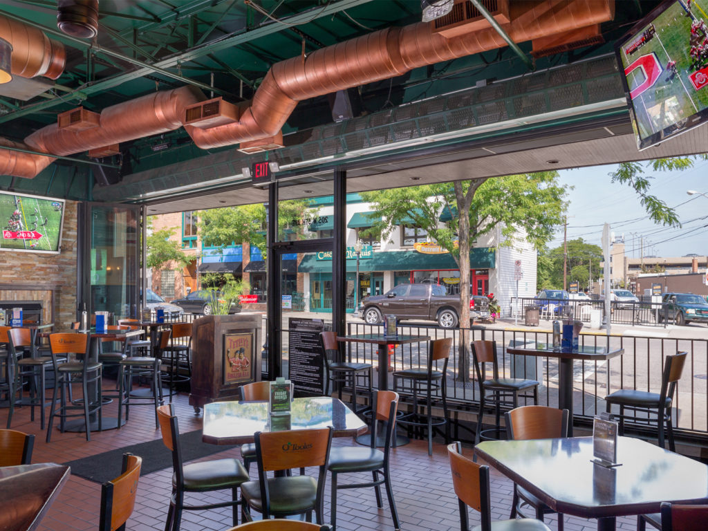 Berner high-performance air curtain installed above wide open-air restaurant entrance