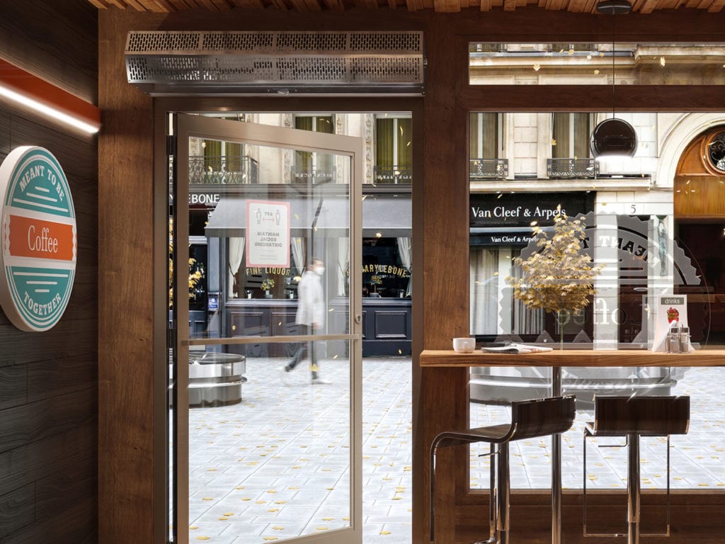 Berner air curtain installed above a café's single-door front entrance